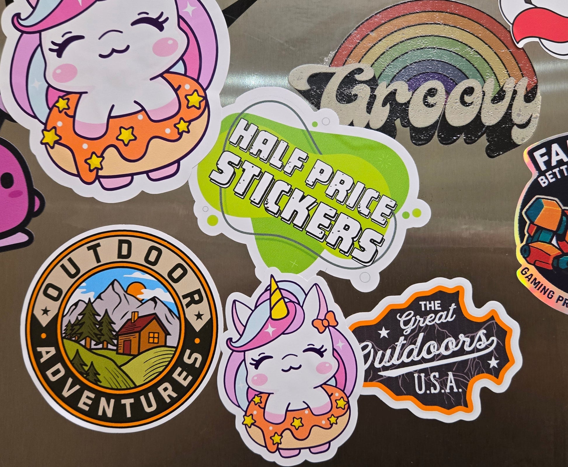Collection of various stickers on a reflective surface